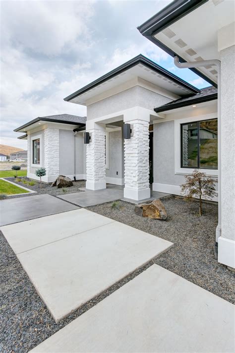 white stone house with metal roof|white stone exterior home.